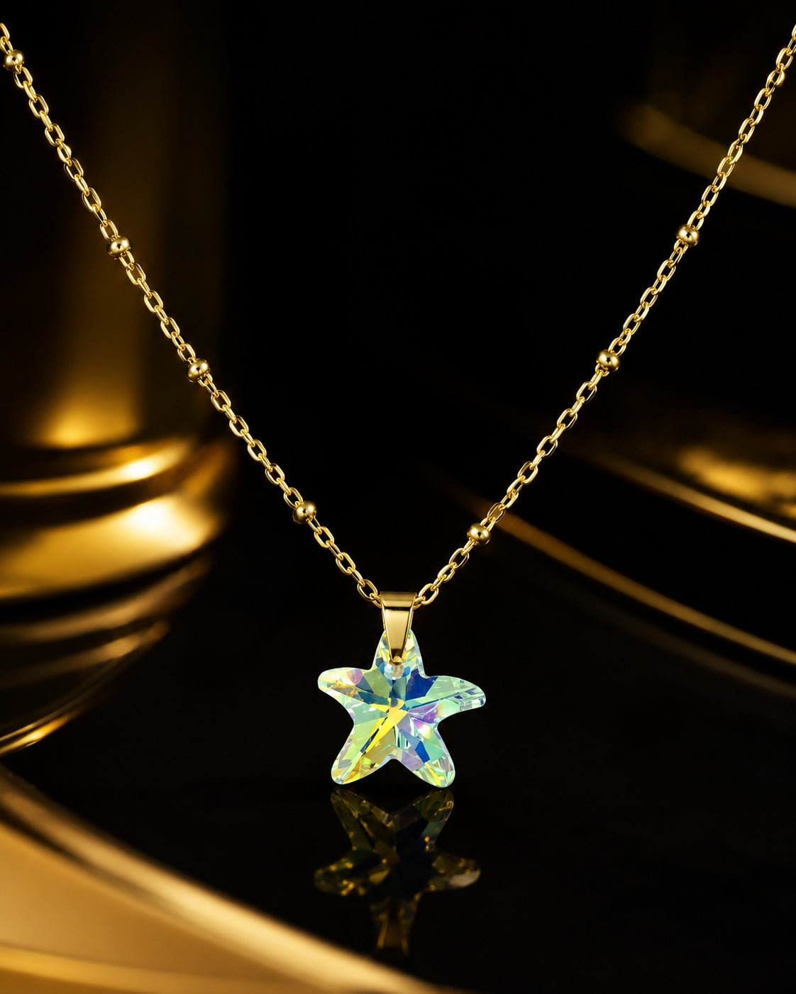 Le collier petite étoile de mer en cristal doré